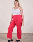 Angled front view of Western Pants in Hot Pink and Cropped Cami in Vintage Tee Off-White worn by Lish