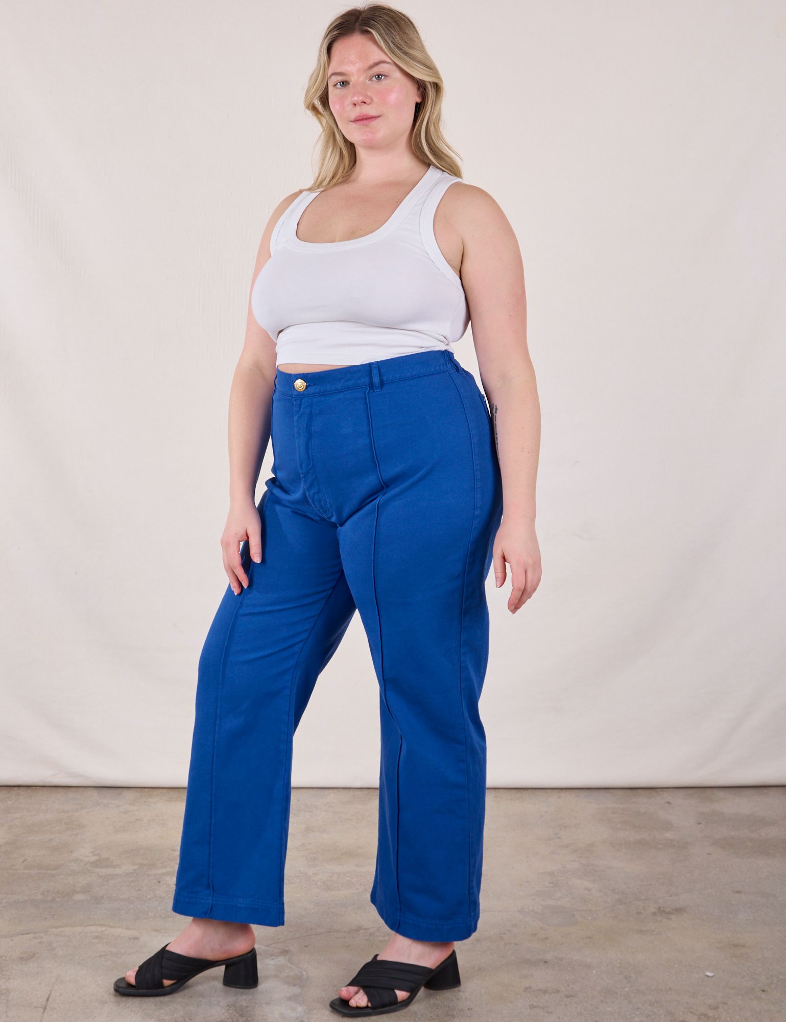 Angled front view of Western Pants in Royal Blue and Cropped Tank in Vintage Tee Off-White on Lish