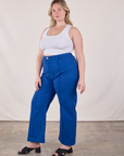 Angled front view of Western Pants in Royal Blue and Cropped Tank in Vintage Tee Off-White on Lish