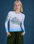 Madeline is 5’9” and wearing P Floral Long Sleeve Baby Tee in Baby Blue