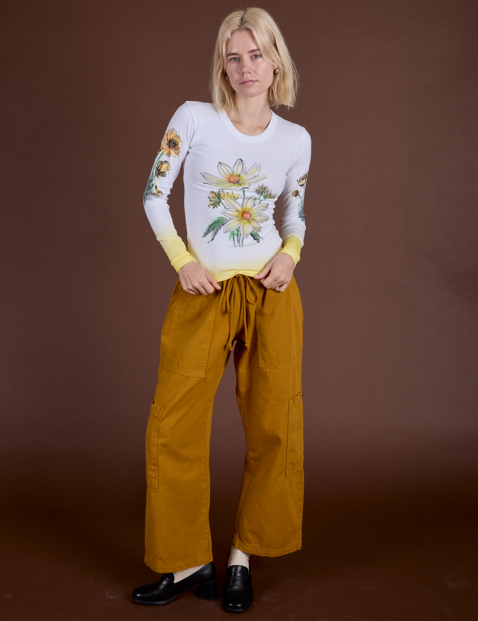 Madeline is wearing Floral Long Sleeve Baby Tee in Yellow and spicy mustard Drop Pocket Cargo Pants