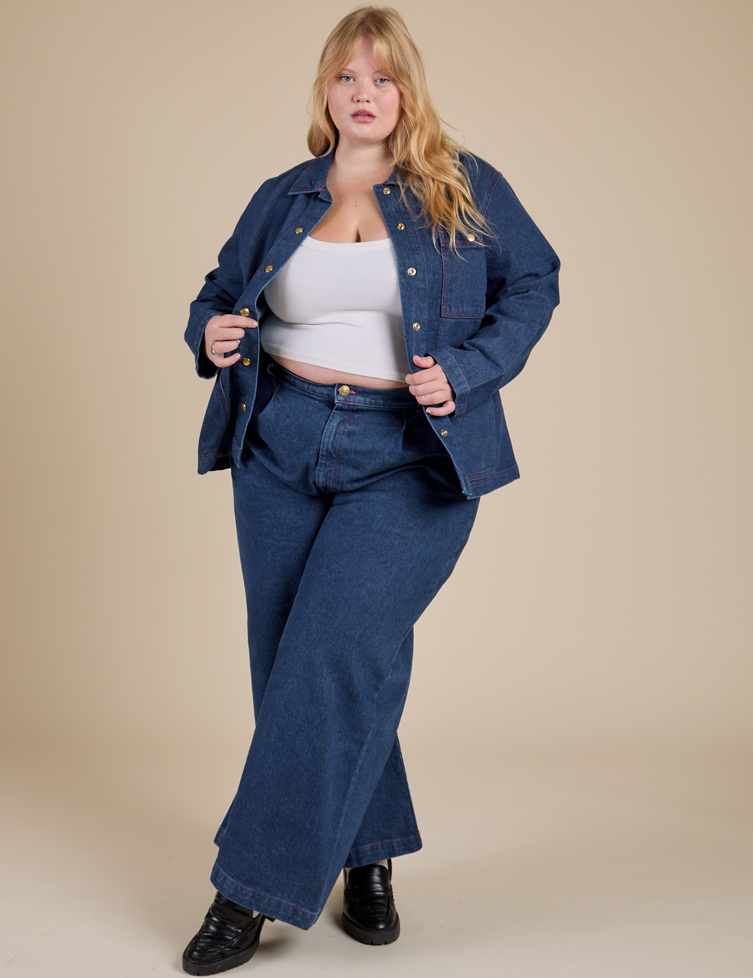 Juliet is wearing Indigo Denim Work Jacket in Dark Wash and dark wash Indigo Wide Leg Trousers