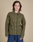 Hana is 5'3" and wearing P Denim Work Jacket in Surplus Green