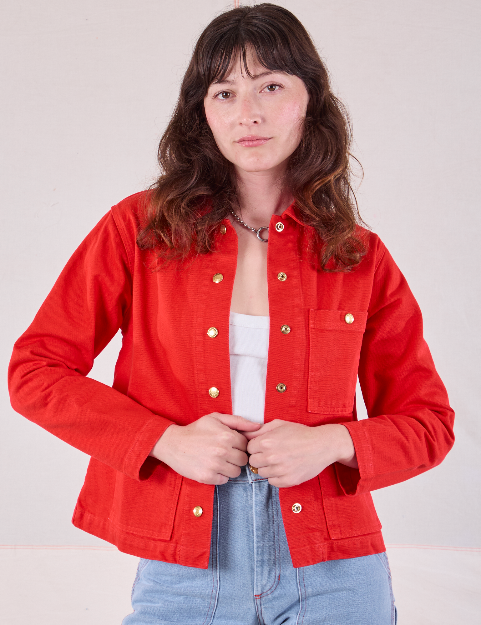 Alex is 5&#39;8&quot; and wearing P Denim Work Jacket in Mustang Red