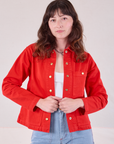 Alex is 5'8" and wearing P Denim Work Jacket in Mustang Red