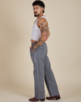 Side view of Work Pants in Washed Grey and Cropped Tank in Vintage Tee White on Jesse