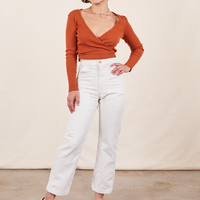 Soraya is 5'2" and wearing Petite XXS Work Pants in Vintage Off-White paired with burnt terracotta Wrap Top