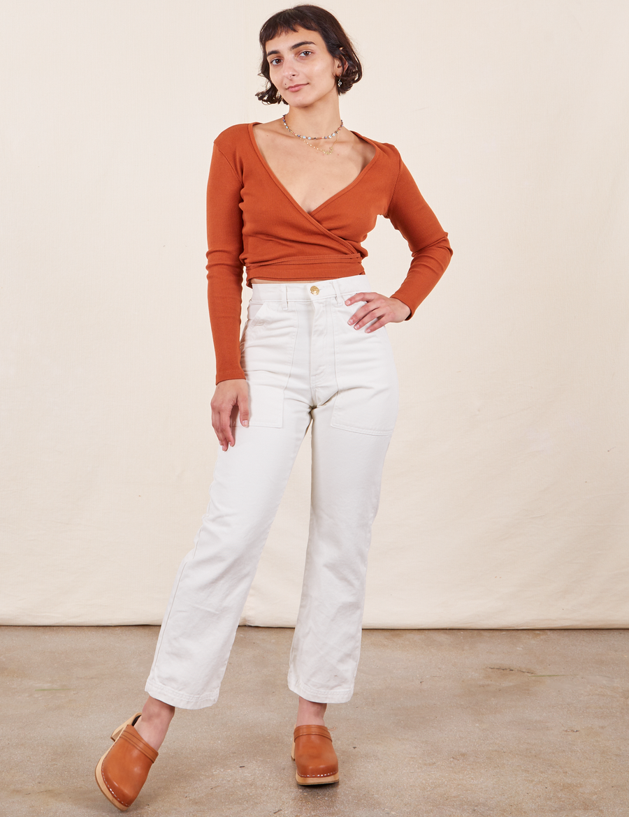 Soraya is 5'2" and wearing Petite XXS Work Pants in Vintage Off-White paired with burnt terracotta Wrap Top