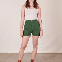 Alexis wearing Classic Work Shorts in Dark Emerald Green and vintage off-white Tank Top