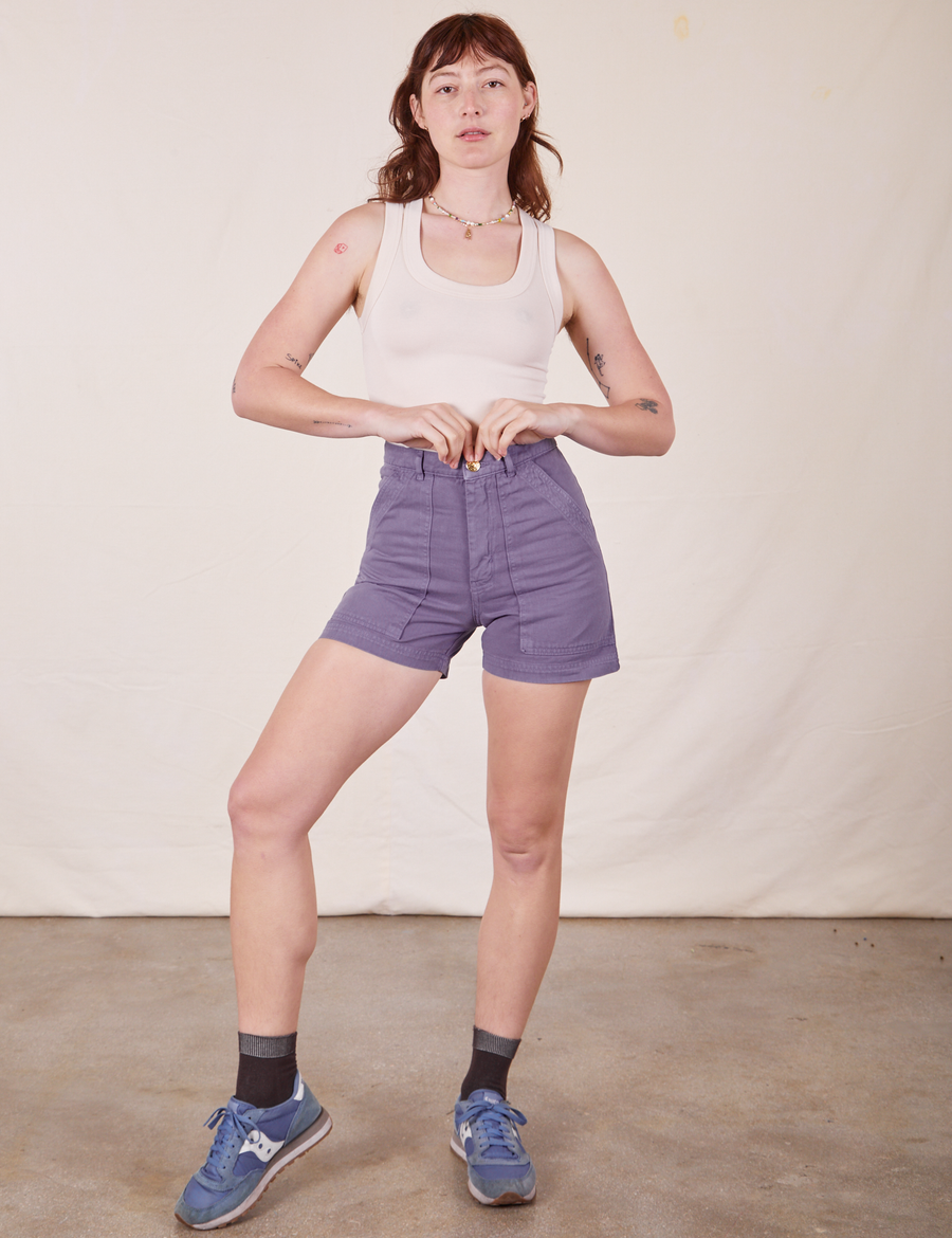 Alex is wearing Classic Work Shorts in Faded Grape and vintage off-white Tank Top