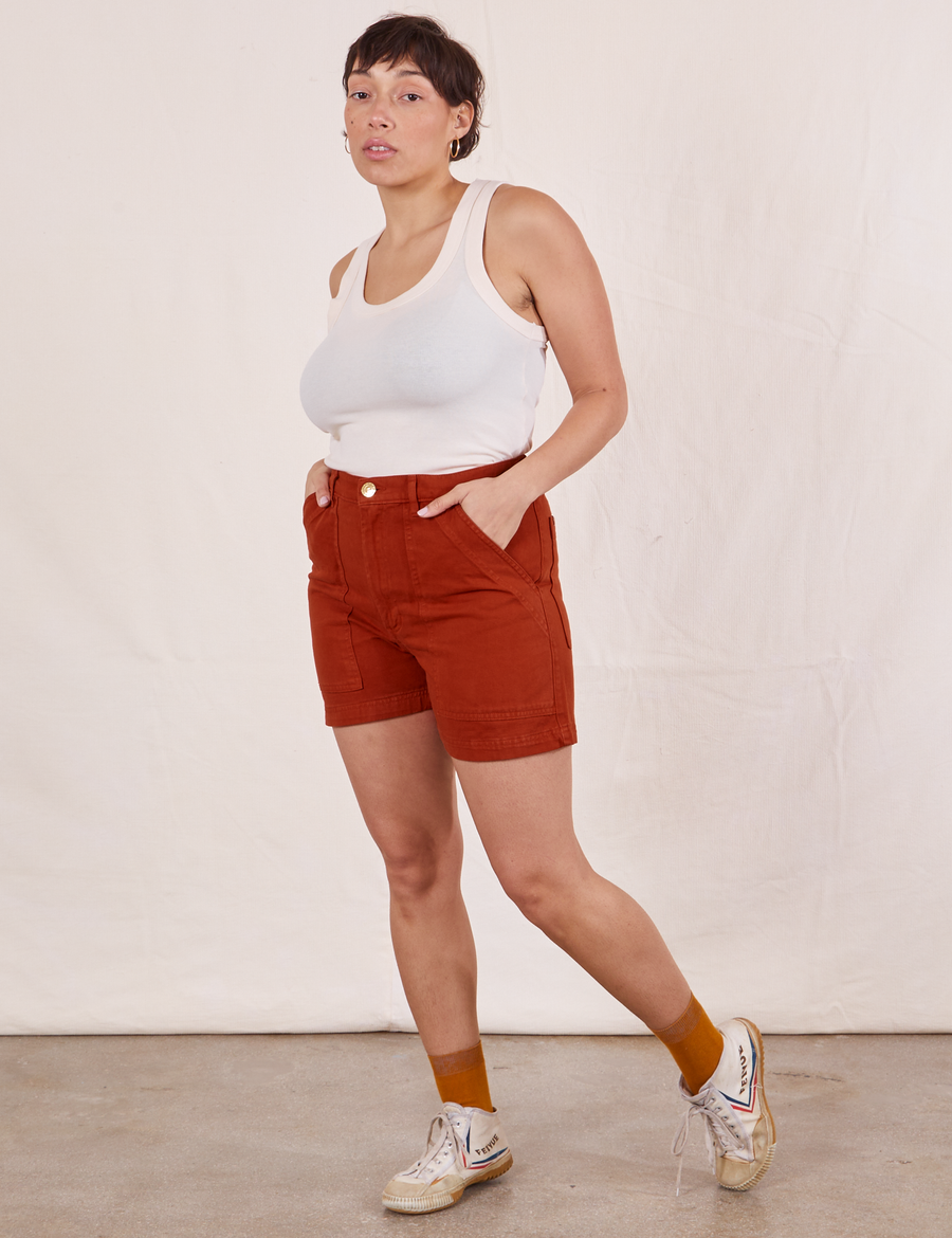 Tiara is wearing Classic Work Shorts in Paprika and vintage off-white Tank Top