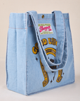 Angled view of Shopper Tote in Golden Horseshoe