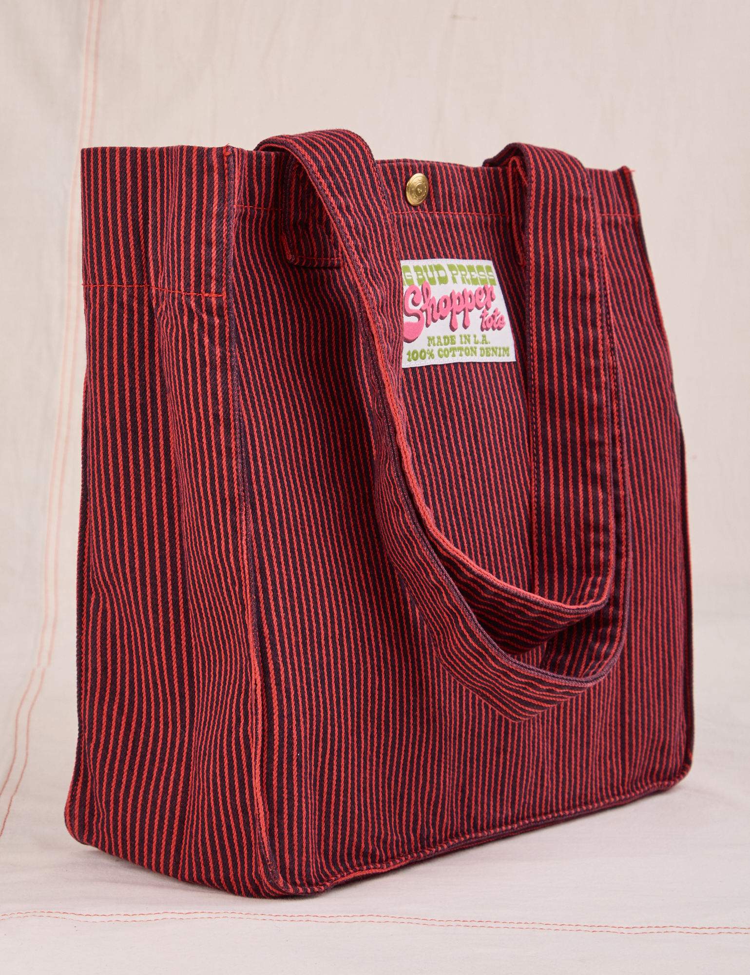 Angled view of Railroad Shopper Tote in Mustang Red