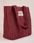 Angled view of Railroad Shopper Tote in Mustang Red