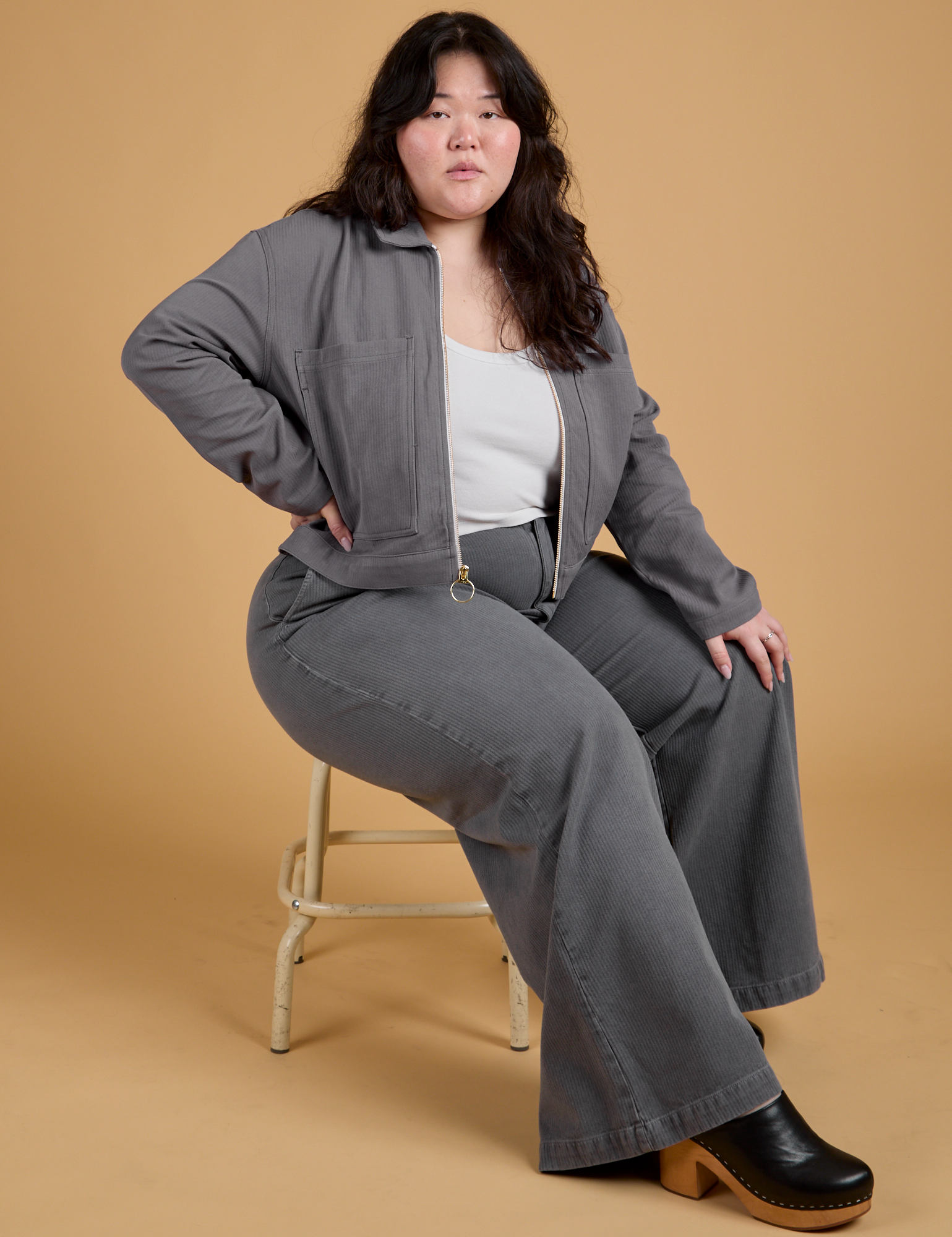 Ashley is wearing Heritage Mechanic Jacket in Washed Grey and matching Wide Leg Trosers