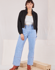 Tiara is wearing Ricky Jacket in Basic Black with a vintage tee off-white Cropped Tank Top and light wash Carpenter Jeans