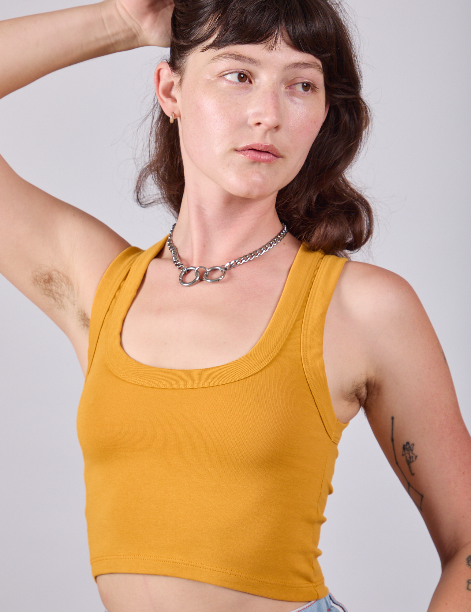 Cropped Tank Top in Mustard Yellow close up on Alex