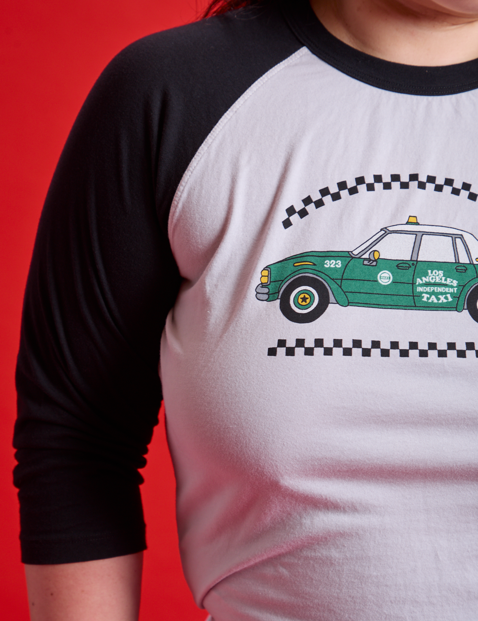 Taxi Raglan Tee in Los Angeles front close up on Ashley