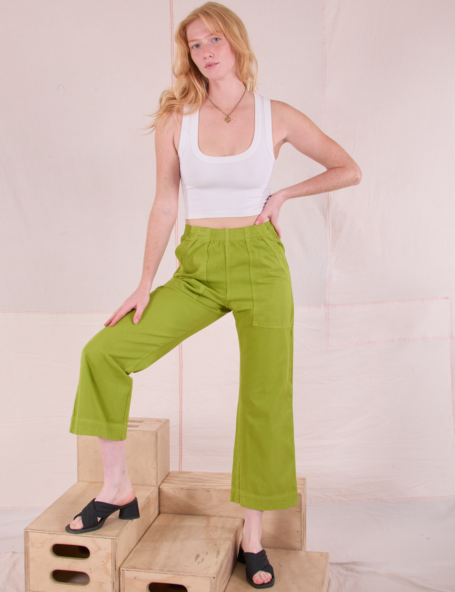 Margaret is wearing Action Pants in Gross Green and Cropped Tank in Vintage Tee Off-White