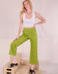 Margaret is wearing Action Pants in Gross Green and Cropped Tank in Vintage Tee Off-White