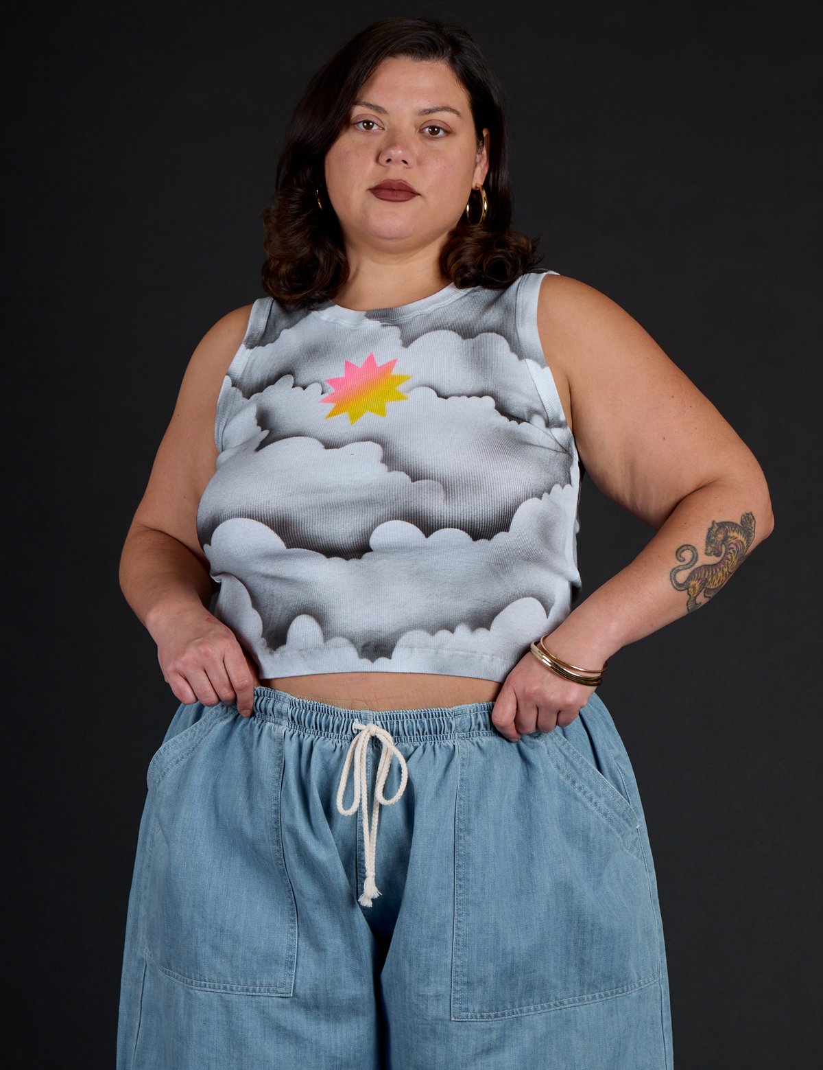 Kristen wearing the Dark Cloud Airbrush Muscle Tee with Light Wash Denim Drop Pocket Pants