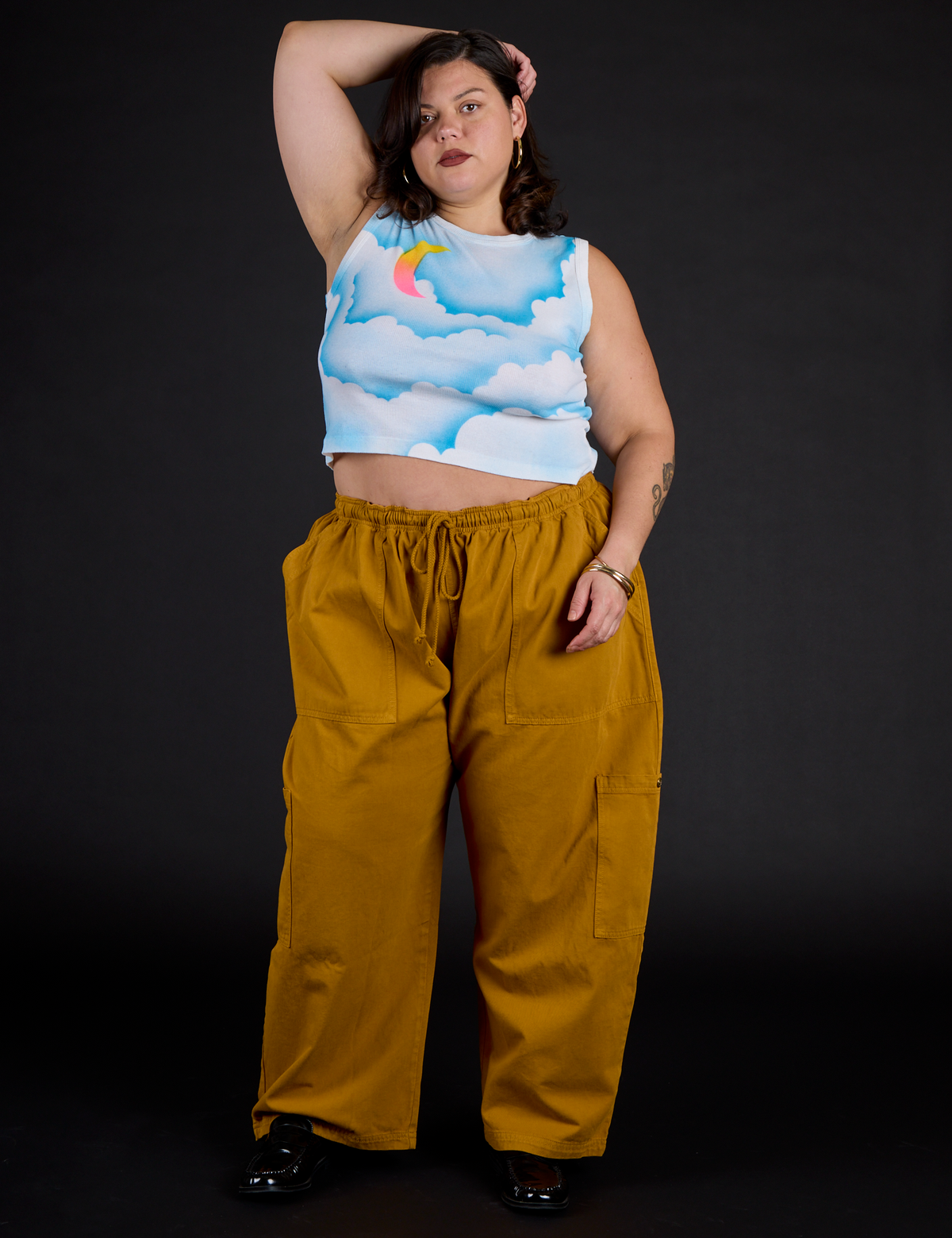 Kristen wearing the Morning Moon Airbrush Muscle Tee with Spicy Mustard Drop Pocket Cargo Pants