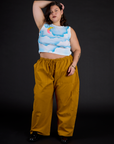 Kristen wearing the Morning Moon Airbrush Muscle Tee with Spicy Mustard Drop Pocket Cargo Pants