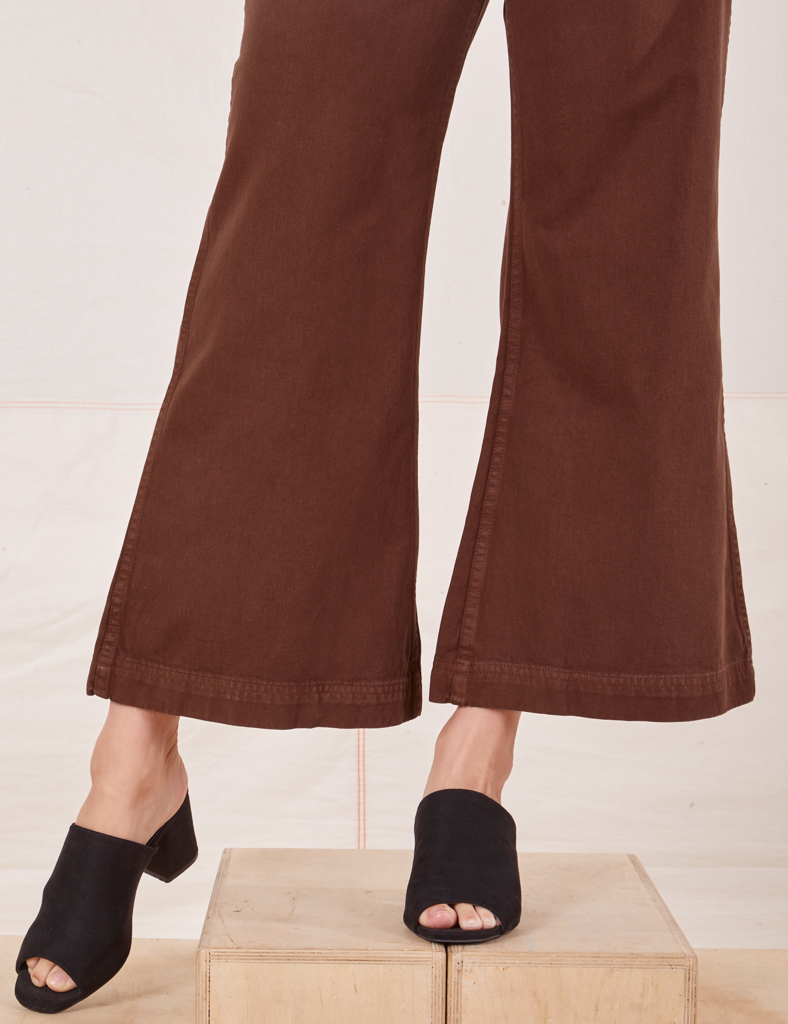 Bell Bottoms in Fudgesicle Brown pant leg close up on Alex