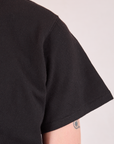 Burly Tee in Basic Black sleeve close up on Quinn