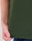 Burly Tee in Swamp Green bottom hem close up on Quinn