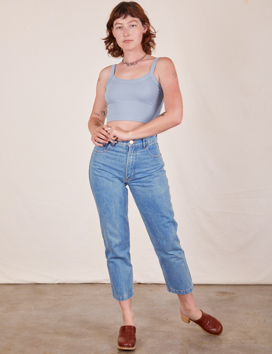 Alex is wearing Cropped Cami in Periwinkle and light wash Frontier Jeans