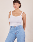 Tiara is wearing Cropped Cami in Vintage Off-White and light wash Sailor Jeans