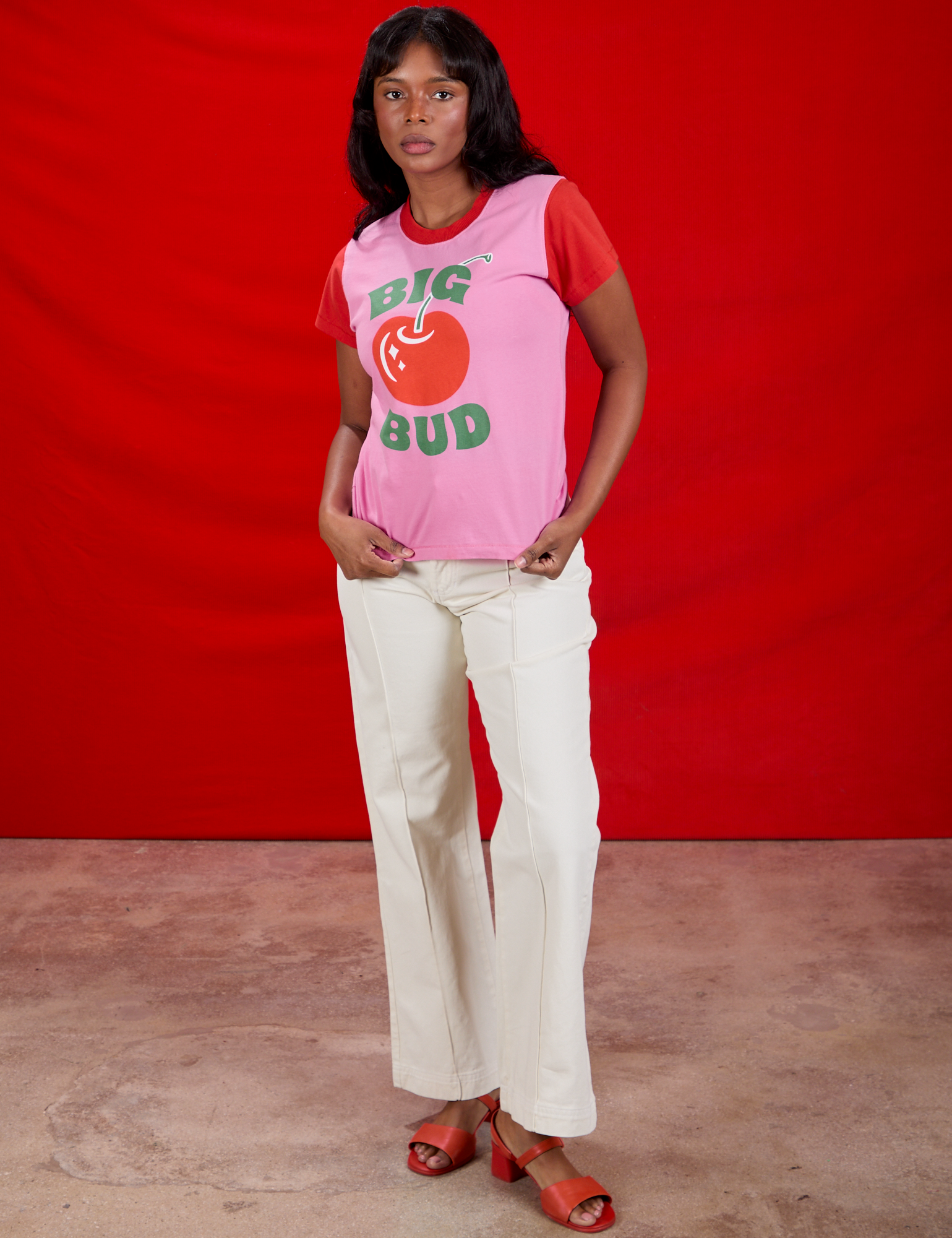 Kandia is wearing Vintage Tee in Big Red Cherry paired with vintage tee off-white Western Pants