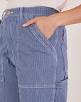 Carpenter Jeans in Railroad Stripes front pocket close up. Tiara has her hand tucked into the pocket.