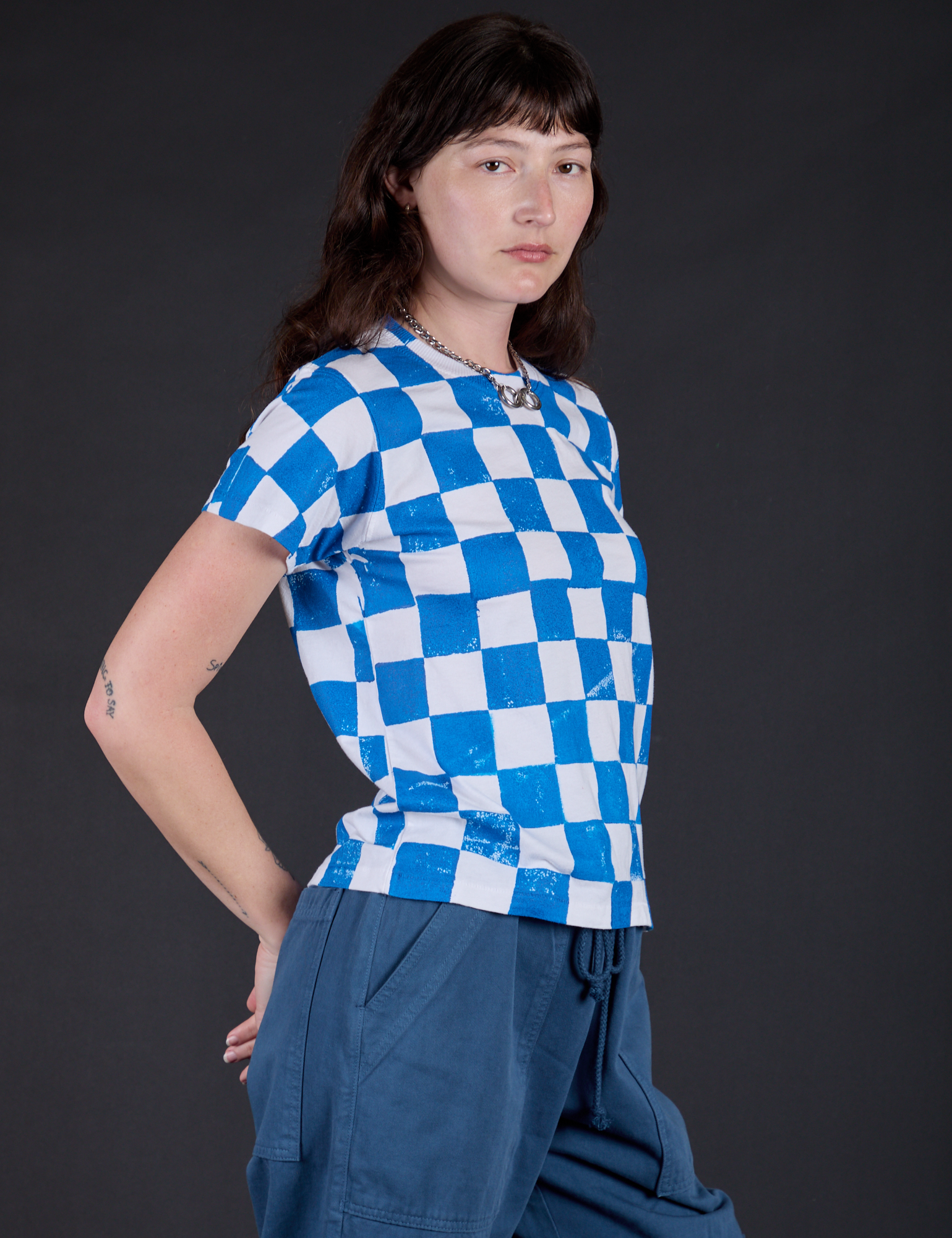 Checker Organic Tee in Blue angled front view on Alex