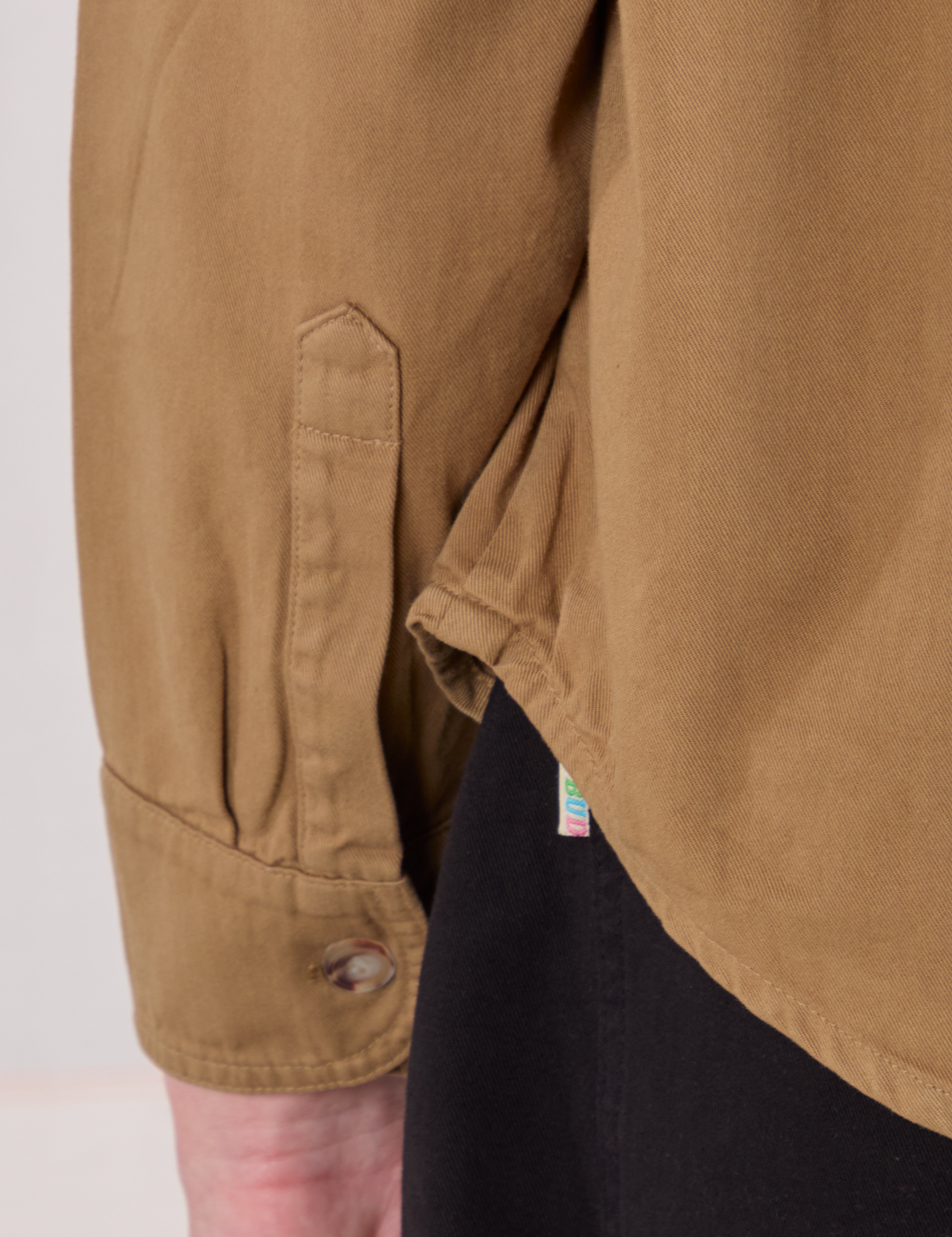 Cropped Overshirt in Desert Brown bottom hem close up on Quinn