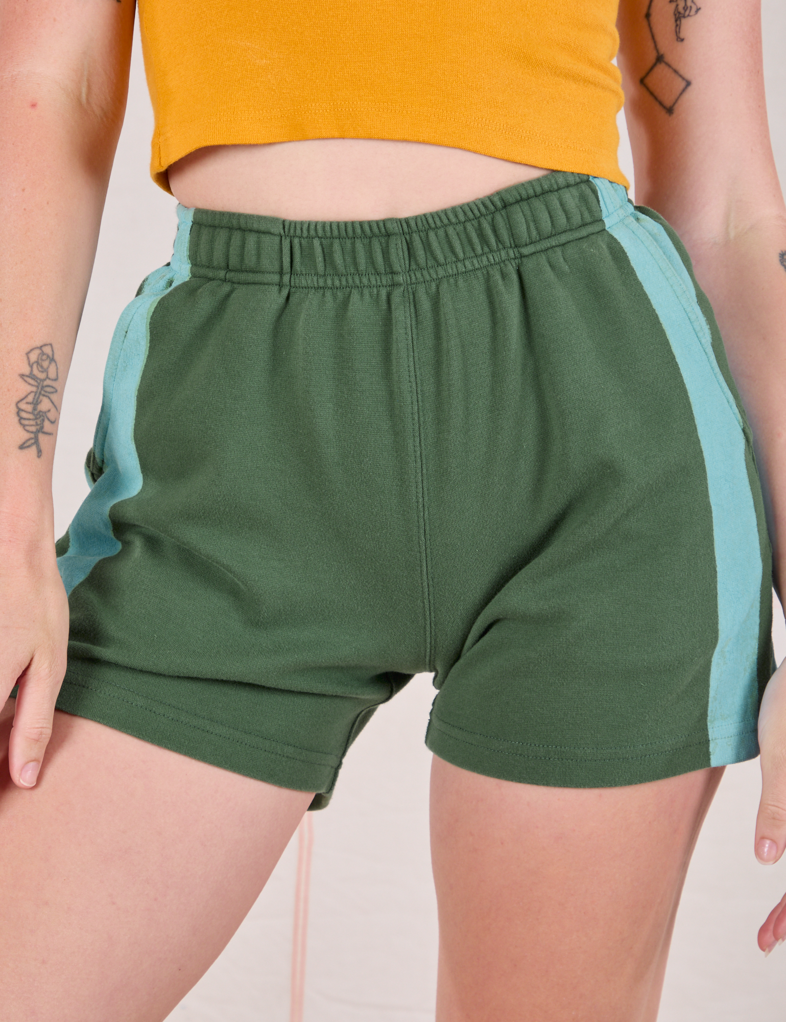 Painted Stripe Easy Shorts in Dark Emerald Green front close up on Alex