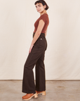 Side view of Western Pants in Espresso Brown paired with a fudgesicle brown V-Neck Tee worn by Soraya