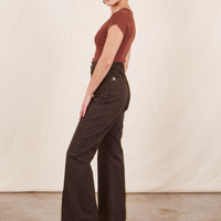 Side view of Western Pants in Espresso Brown paired with a fudgesicle brown V-Neck Tee worn by Soraya