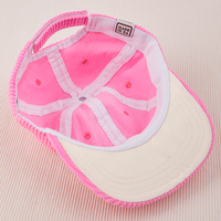 Inside look of Dugout Corduroy Hat in Bubblegum Pink. White Satin underbill.