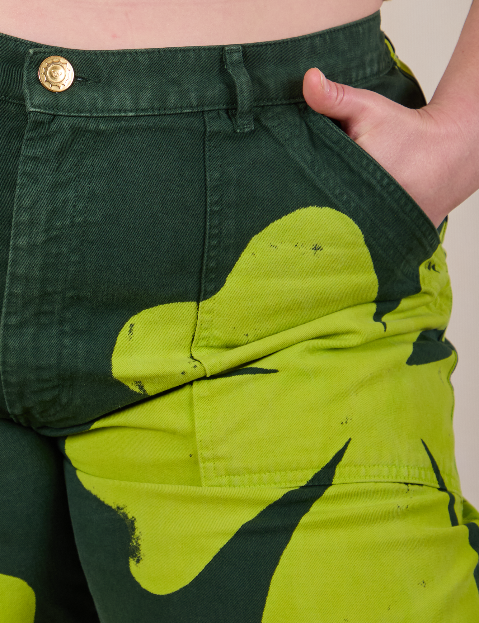 Close up of Lish&#39;s hand in the front pocket of Paintstamped Clover Work Pant