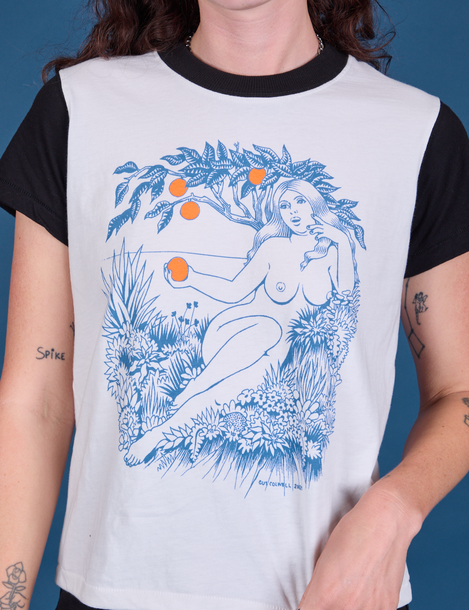 Vintage Tee in California Girl front close up. White tee body with black sleeves and neckline.