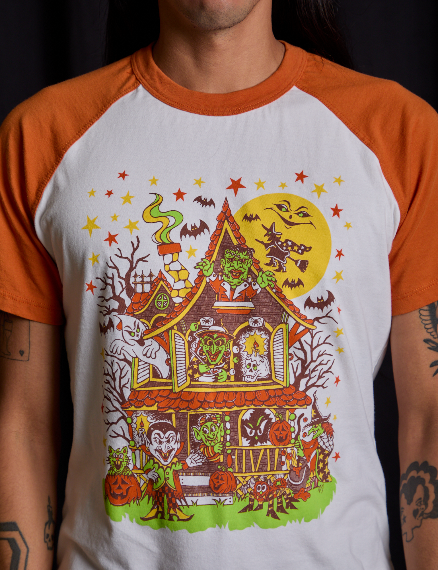 Short Sleeve Raglan Tee in Haunted House front close up on Anthony