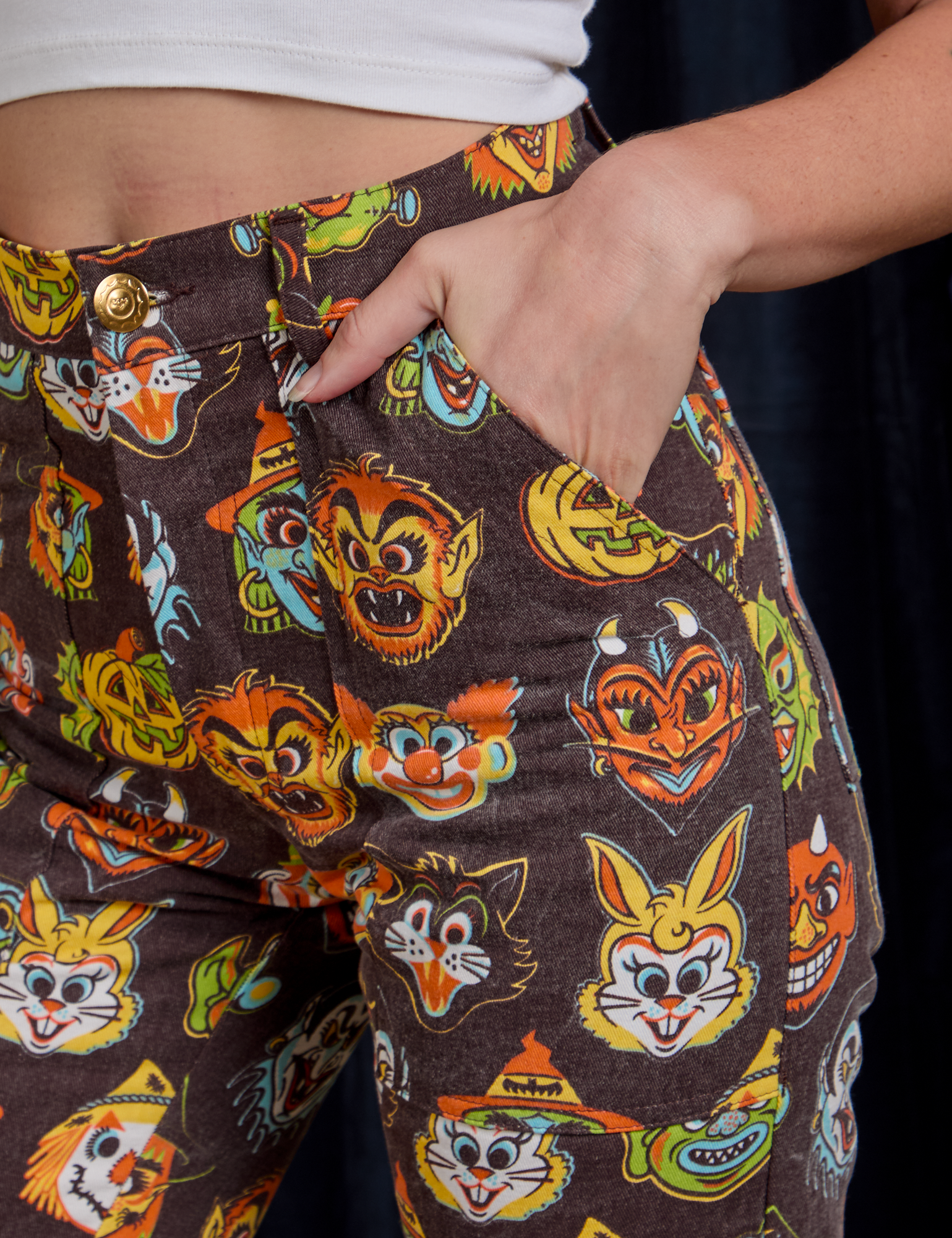 Close up of Alex&#39;s hand in the front pocket of Work Pants in Halloween Masks