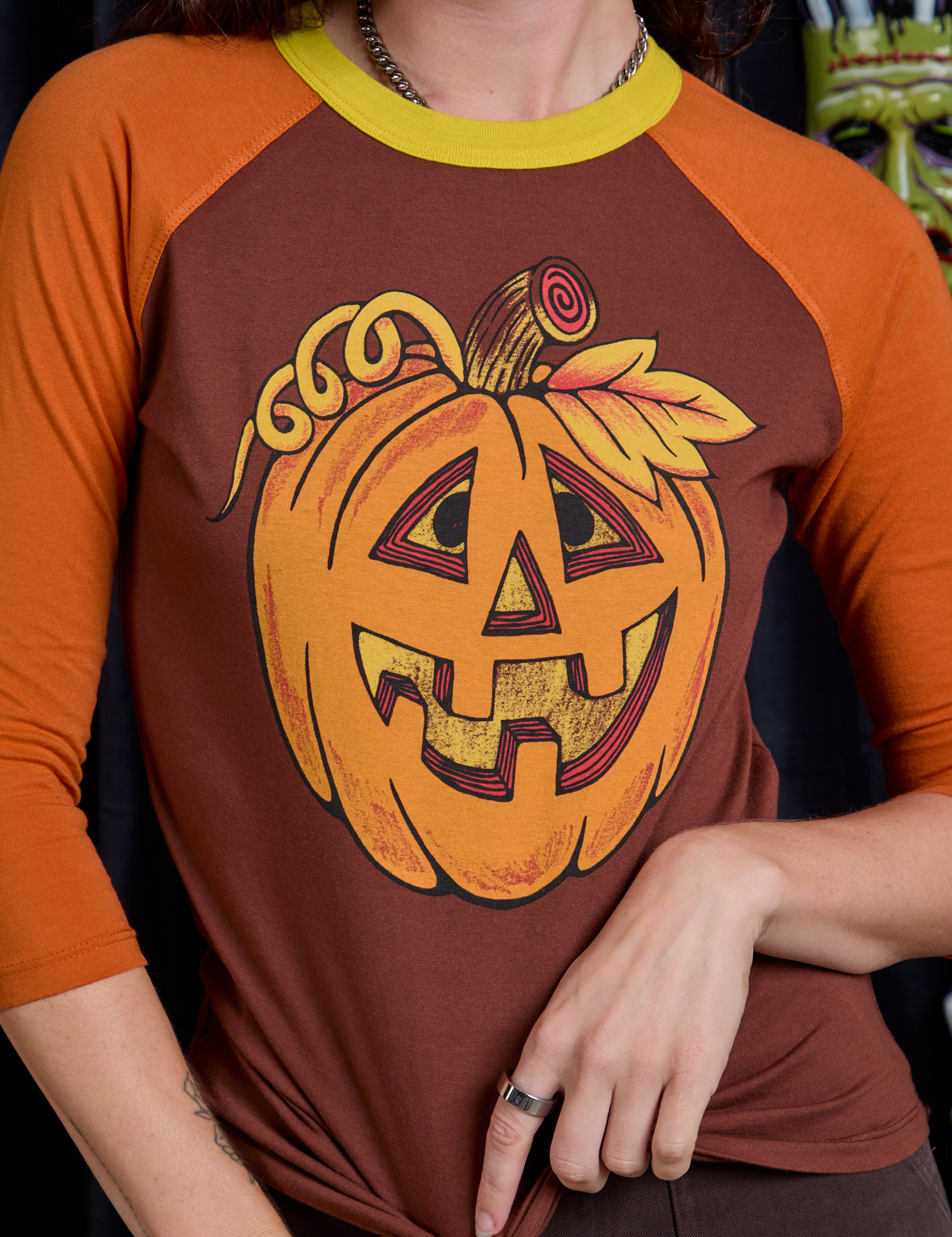 Raglan Tee in Jack-O-Lantern front close up on Alex