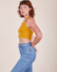 Side view of Halter Top in Mustard Yellow worn by Alex