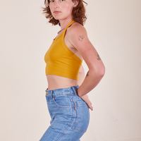 Side view of Halter Top in Mustard Yellow worn by Alex