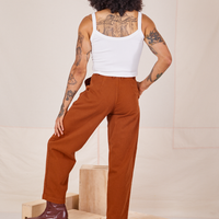 Back view of Heavyweight Trousers in Burnt Terracotta and vintage off-white Cropped Cami worn by Jesse