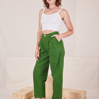 Angled view of Heavyweight Trousers in Lawn Green and vintage off-white Cropped Cami worn by Alex