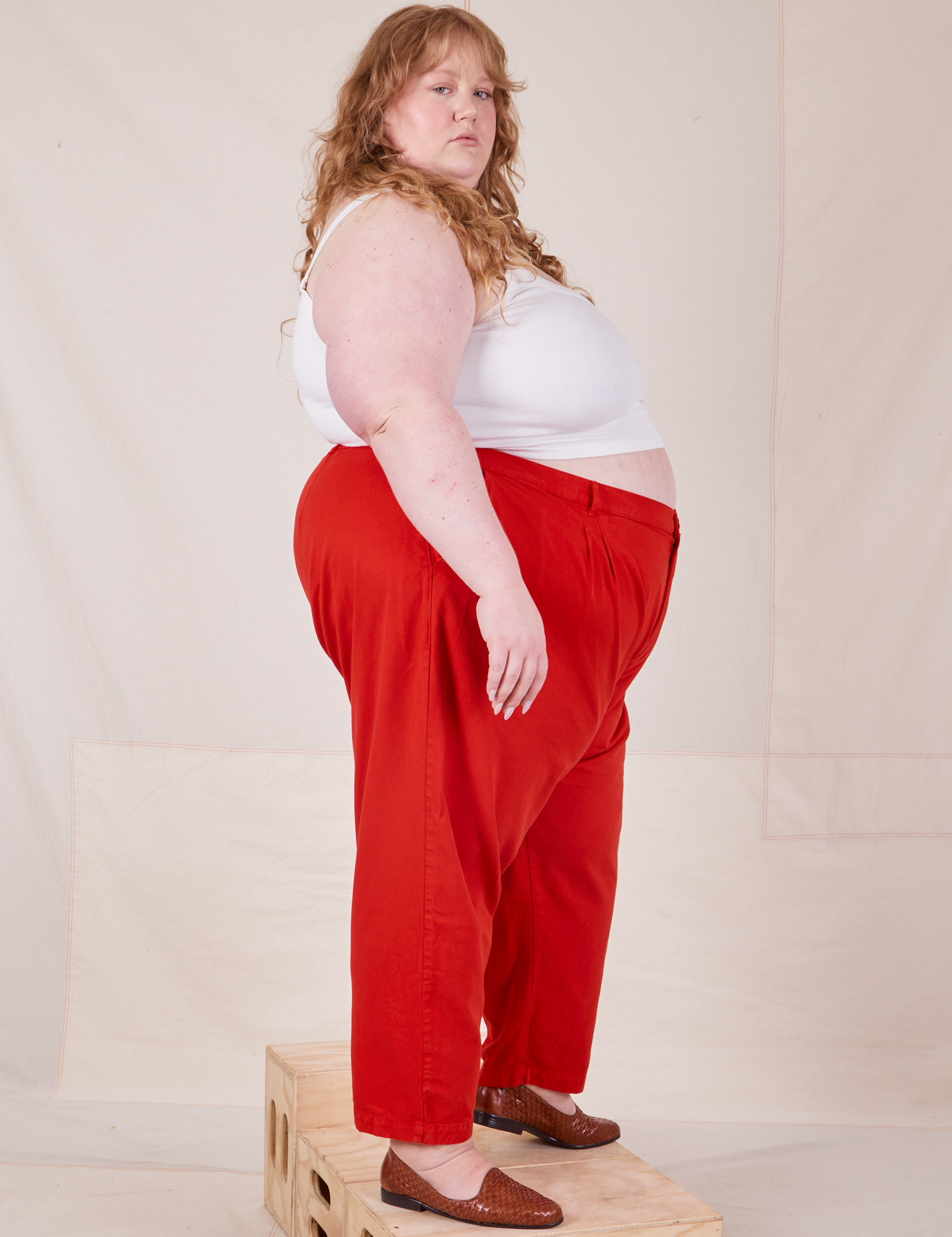 Side view of Heavyweight Trousers in Mustang Red worn by Catie
